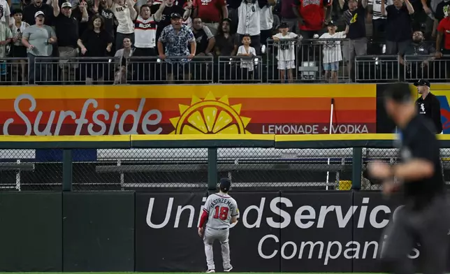 Atlanta Braves left fielder Mike Yastrzemski (18) watches Chicago White Sox's Braden Montgomery's walk-off two-run home run in the 10th inning of a baseball game to defeat the Atlanta Braves in Chicago, Tuesday, June 9, 2026. (AP Photo/Paul Beaty)