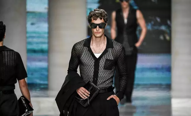 A model wears a creation from the Dolce & Gabbana Spring/Summer 2027 Men's collection presented in Milan, Italy, Saturday, June 20, 2026. (AP Photo/Nicola Marfisi)