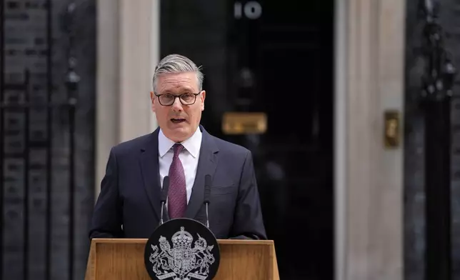 Britain's Prime Minister Keir Starmer announces his resignation to the media outside 10 Downing Street in London, Monday, June 22, 2026. (AP Photo/Kin Cheung)