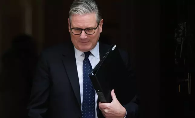 FILE - Britain's Prime Minister Keir Starmer leaves 10 Downing Street in London, Monday, April 20, 2026 to face a showdown in Parliament over the appointment of Peter Mandelson as ambassador to Washington. (AP Photo/Alastair Grant, File)