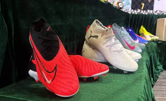 Soccer boots are showcased by Hong Kong customs authorities in a new conference about counterfeit and infringing goods at their headquarters in North Point, Hong Kong Thursday, June 11, 2026. (AP Photo/Kanis Leung)