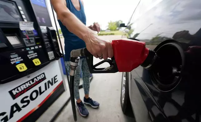 FILE - A customer readies to pump gas at this Ridgeland, Miss., Costco, Tuesday, May 24, 2022. s. (AP Photo/Rogelio V. Solis, File)