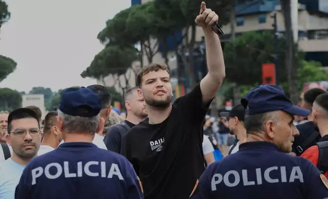 Police officers block a street during a demonstration in Tirana, Albania, Wednesday, June 3, 2026, opposing a luxury coastal development project linked to Jared Kushner and Ivanka Trump over concerns about environmental impacts and transparency. (AP Photo/Hameraldi Agolli)