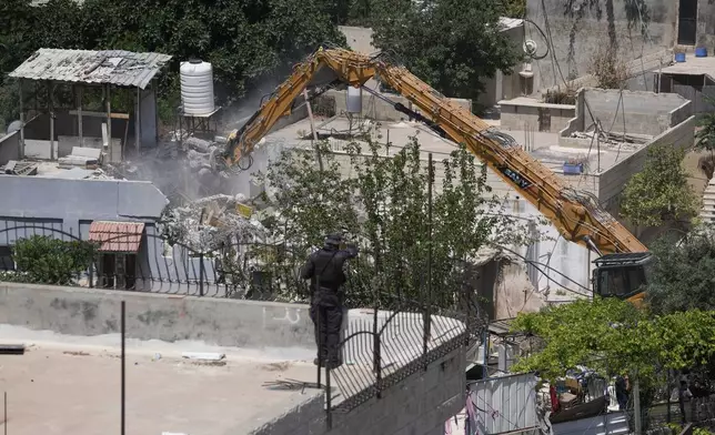 Israeli authorities demolish a Palestinian home in the Silwan neighborhood of east Jerusalem, May 25, 2026. (AP Photo/Mahmoud Illean)