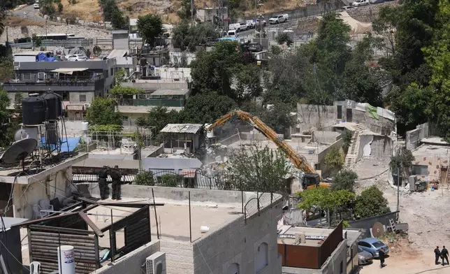 Israeli authorities demolish a Palestinian home in the Silwan neighborhood of east Jerusalem, May 25, 2026. (AP Photo/Mahmoud Illean)