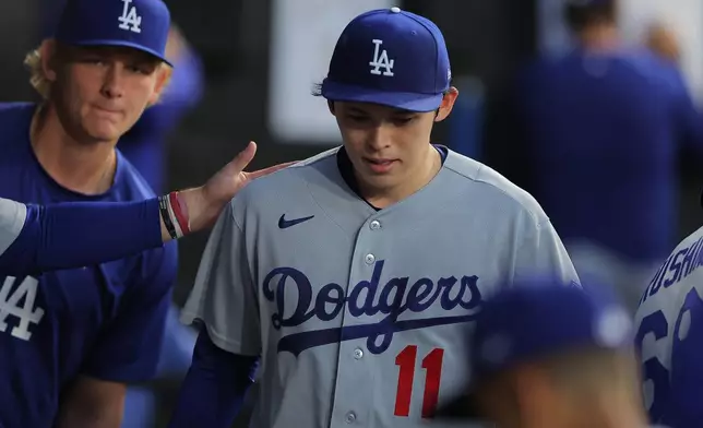 Los Angeles Dodgers' Roki Sasaki exits the game during the fifth inning of a baseball game against the Chicago White Sox, Friday, June 12, 2026, in Chicago. (AP Photo/Melissa Tamez)