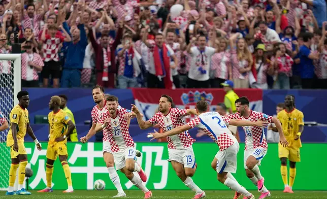 Croatia's Nikola Vlasic (13) celebrates with teammates after scoring his side's second goal during the World Cup Group L soccer match between Croatia and Ghana in Philadelphia, Saturday, June 27, 2026. (AP Photo/Matt Slocum)