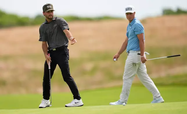 Ryder Cowan reacts after missing a putt on the 13th hole during the second round of the U.S. Open golf tournament at Shinnecock Hills Golf Club in Southampton, N.Y., Friday, June 19, 2026.(AP Photo/David J. Phillip)