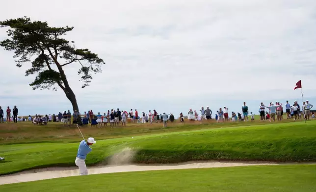 William Mouw hits from the bunker on the 13th hole during the second round of the U.S. Open golf tournament at Shinnecock Hills Golf Club in Southampton, N.Y., Friday, June 19, 2026.(AP Photo/David J. Phillip)