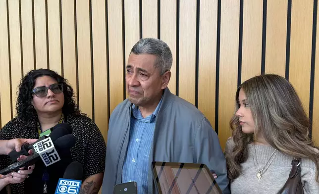 Jose Real, center, and Masciell Real, right, the father and sister of Ashley Real, speak to reporters in Portland, Ore. on Wednesday, June 3, 2026, after Jesse Calhoun was arraigned on a second-degree murder charge for Ashley's death. (AP Photo/Claire Rush)