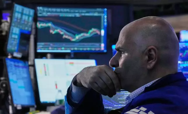 Specialist Philip Finale works on the floor of the New York Stock Exchange, Friday, June 26, 2026. (AP Photo/Richard Drew)