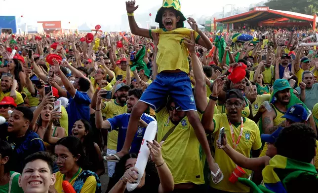 Brazil fans celebrate after Brazil defeated Japan at a World Cup soccer match as they watch a live broadcast of the game on Copacabana Beach in Rio de Janeiro, Brazil, Monday, June 29, 2026. (AP Photo/Bruna Prado)