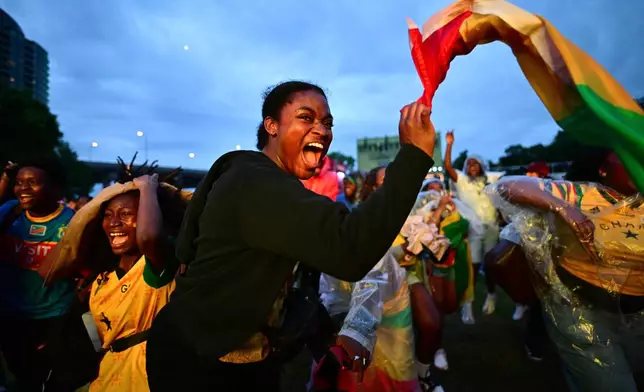 Fans celebrate after Ghana scored as they watch the World Cup Group L soccer match between Ghana and Panama on a screen at FIFA Fan Fest in Toronto, Wednesday, June 17, 2026. (Sammy Kogan/The Canadian Press via AP)
