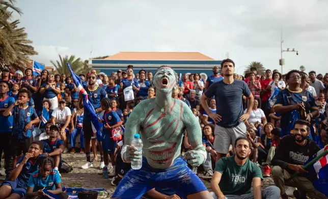 A fan reacts as he watches a broadcast of the World Cup Group H soccer match between Cape Verde and Spain at a viewing center in Mindelo, São Vicente, Cape Verde, Monday, June 15, 2026. (AP Photo/Queila Fernandes)