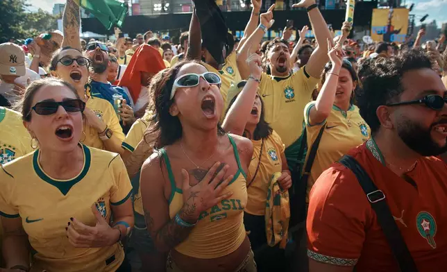 Brazil's fans sing while watching the FIFA World Cup Group C match between Brazil and Morocco during a public watch party in Central Park, Saturday, June 13, 2026, in New York. (AP Photo/Andres Kudacki)