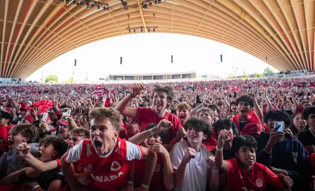 Canadian fans celebrate after Canada defeated South Africa during a World Cup round of 32 soccer match, at FIFA Fan Fest in Vancouver, Sunday, June 28, 2026. (Darryl Dyck/The Canadian Press via AP)