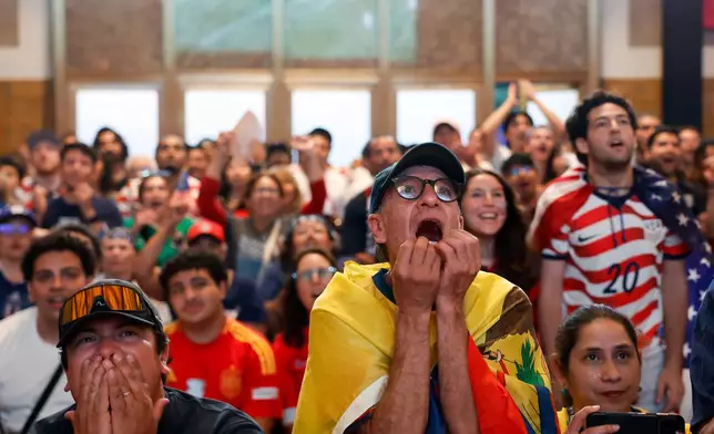 Fans react as they watch a broadcast of the World Cup Group D soccer match between the United States and Turkey at a watch party in Union Station, Thursday, June 25, 2026, in Los Angeles. (AP Photo/Caroline Brehman)