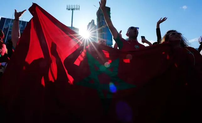 Morocco fans cheer on their team during a public watch party for the World Cup Group C soccer match between Brazil and Morocco, at Bayfront Park in downtown Miami, Saturday, June 13, 2026. AP Photo/Rebecca Blackwell)