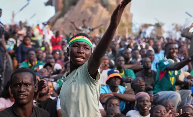 A Senegalese fan reacts as he watches a broadcast of the World Cup Group I soccer match between Senegal and France in Dakar, Senegal, Tuesday, June 16, 2026. (AP Photo/Misper Apawu)