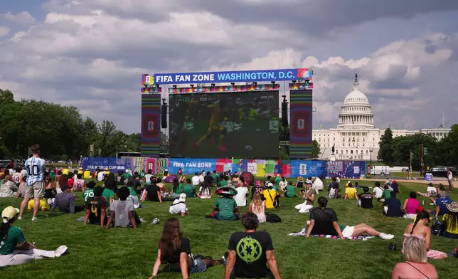 Fans watch the first match of the World Cup between Mexico and South Africa on the National Mall, Thursday, June 11, 2026, in Washington. (AP Photo/Allison Robbert)
