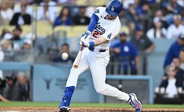 Los Angeles Dodgers' Kyle Tucker hits a three-run home run during the second inning of a baseball game against the Tampa Bay Rays, Monday, June 15, 2026, in Los Angeles. (AP Photo/William Liang)
