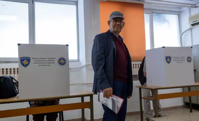 A man votes during parliamentary election in Kosovo capital Pristina, on Sunday, June 7, 2026. (AP Photo/Visar Kryeziu)