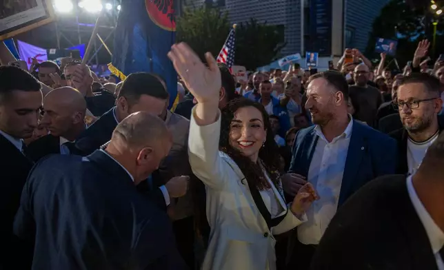 Vjosa Osmani, Kosovo former president, waves to supporter at the closing political rally of the Democratic League of Kosovo (LDK), in capital Pristina on Friday, June 5, 2026. (AP Photo/Visar Kryeziu)