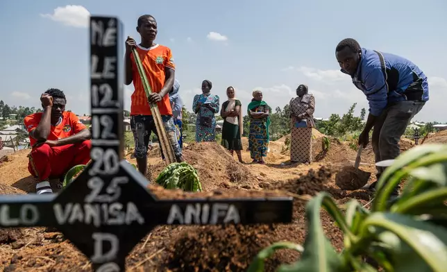 Relatives of Vanisa Anifa, a 6-month-old orphaned girl who died of Ebola, attend her burial, in Bunia, Congo, Friday, June 19, 2026. (AP Photo/Moses Sawasawa)