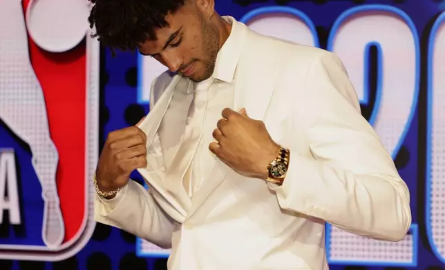 Cameron Boozer arrives for the first round of the NBA basketball draft Tuesday, June 23, 2026, in New York. (AP Photo/Adam Hunger)