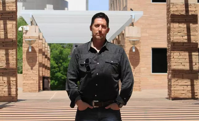 DEA Special Agent David Howell, who filed a whistleblower complaint, poses for a portrait outside the U.S. district courthouse in Albuquerque, N.M., on Friday, June 12, 2026. (AP Photo/Susan Montoya Bryan)