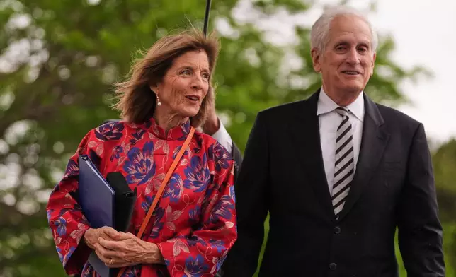 Former Ambassador Caroline Kennedy, left, arrives with her husband Ed Schlossberg for the Profile in Courage Award at the John F. Kennedy Presidential Library, Sunday, May 31, 2026, in Boston. (AP Photo/Charles Krupa)