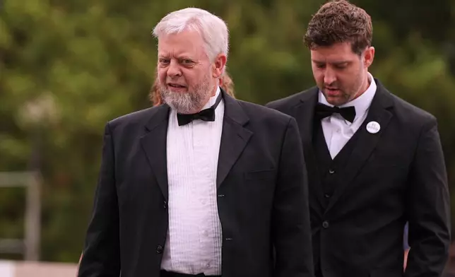 Tim Ganger, left, father of Renee Good, arrives with his son Brent Ganger for the Profile in Courage Award at the John F. Kennedy Presidential Library, Sunday, May 31, 2026, in Boston. (AP Photo/Charles Krupa)