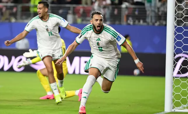 Algeria's Amine Gouiri, front, celebrates after scoring his side's second goal against Jordan during the World Cup Group J soccer match in Santa Clara, Calif., near San Francisco, Monday, June 22, 2026. (AP Photo/Eakin Howard)