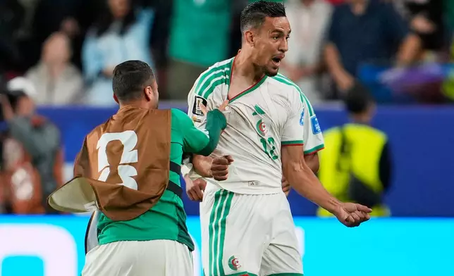 Algeria's Nadhir Benbouali, right, celebrates after scoring his side's opening goal during the World Cup Group J soccer match between Jordan and Algeria in Santa Clara, Calif., near San Francisco, Monday, June 22, 2026. (AP Photo/Eugene Hoshiko)