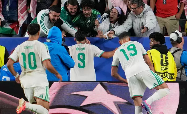 Algeria's Amine Gouiri (9) celebrates with their supporters after scoring his side's second goal during the World Cup Group J soccer match between Jordan and Algeria in Santa Clara, Calif., near San Francisco, Monday, June 22, 2026. (AP Photo/Eugene Hoshiko)