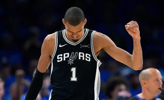 San Antonio Spurs forward Victor Wembanyama celebrates a defensive stop against the Oklahoma City Thunder during the second half of Game 7 of the Western Conference finals of the NBA basketball playoffs series, Saturday, May 30, 2026, in Oklahoma City. (AP Photo/Tony Gutierrez)