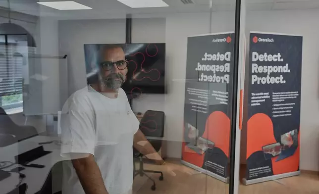 Ioannis Lantounis, head of OroraTech's Greek operations, stands inside the company's Athens office on Thursday, June 18, 2026, as Greece integrates a new constellation of wildfire-detection satellites into its national firefighting system. (AP Photo/Petros Giannakouris)