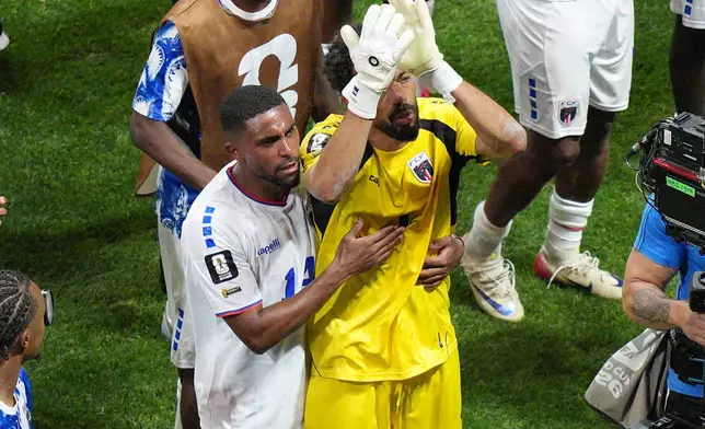 Cape Verde goalkeeper Vozinha (1) and Deroy Duarte (14) celebrate a tie during the World Cup Group H soccer match between Spain and Cape Verde in Atlanta, Monday, June 15, 2026. (AP Photo/Jacob Kupferman)