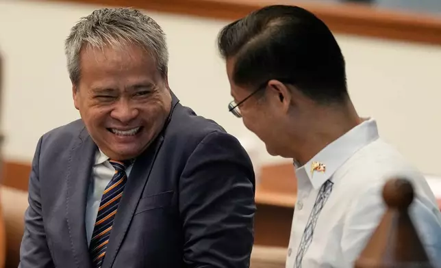Senator Joel Villanueva, left, reacts as he talks with Senator Sherwin Gatchalian at the Philippine Senate in Pasay city, Philippines on Wednesday, June 17, 2026. (AP Photo/Aaron Favila)