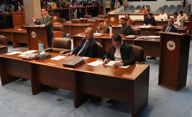 Senator Miguel Zubiri, left, speaks during a special session at the Philippine Senate in Pasay city, Philippines on Wednesday, June 17, 2026. (AP Photo/Aaron Favila)