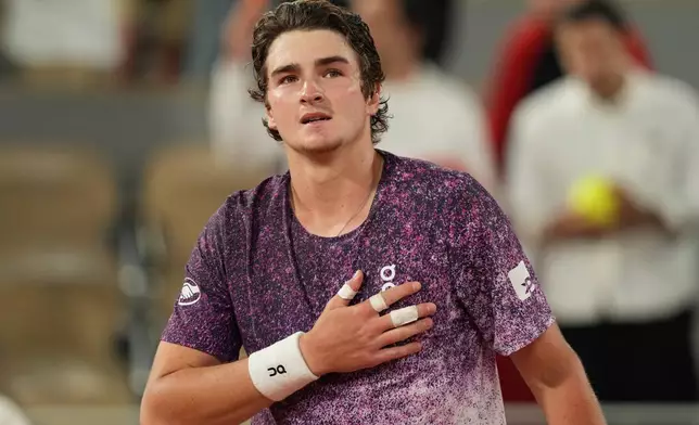 Brazil's Joao Fonseca reacst after winning the fourth-round tennis match against Norway's Casper Ruud at the French Open in Paris, Monday, June 1, 2026. (AP Photo/Thibault Camus)
