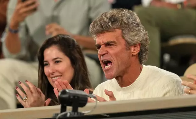 Former French Open winner Gustavo Kuerten watches the fourth-round tennis match between Brazil's Joao Fonseca and Norway's Casper Ruud at the French Open in Paris, Sunday, May 31, 2026. (AP Photo/Thibault Camus)