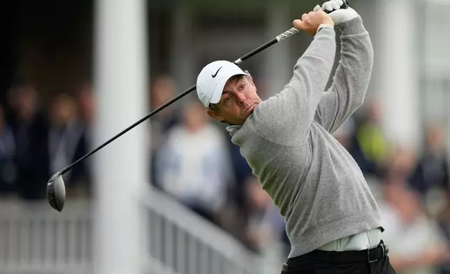 Rory McIlroy, of Northern Ireland, watches his tee shot on the 14th hole during the first round of the U.S. Open golf tournament at Shinnecock Hills Golf Club in Southampton, N.Y., Thursday, June 18, 2026.(AP Photo/Gerald Herbert)