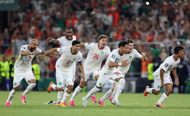 The Moroccan team starts to celebrate after winning on penalty kicks the World Cup round of 32 soccer match between the Netherlands and Morocco in Guadalupe, near Monterrey, Mexico, Monday, June 29, 2026. (AP Photo/Sofia Yaker)