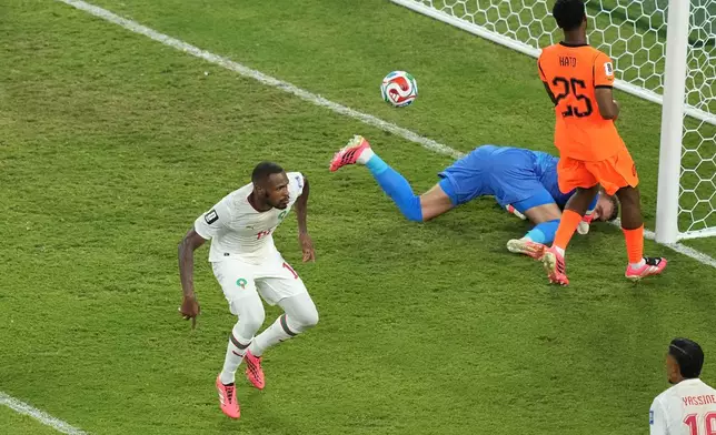 Morocco's Issa Diop (14) celebrates scoring their first goal during the World Cup round of 32 soccer match between the Netherlands and Morocco in Guadalupe, near Monterrey, Mexico, Monday, June 29, 2026. (AP Photo/Moises Castillo)