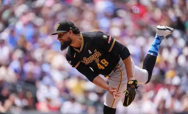 Pittsburgh Pirates relief pitcher Yohan Ramírez works against the Colorado Rockies in the fourth inning of a baseball game Sunday, June 21, 2026, in Denver. (AP Photo/David Zalubowski)