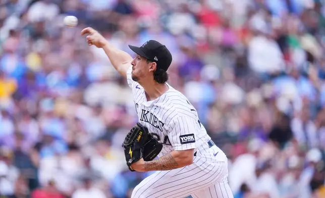 Colorado Rockies starting pitcher Michael Lorenzen works against the Pittsburgh Pirates in the first inning of a baseball game Sunday, June 21, 2026, in Denver. (AP Photo/David Zalubowski)