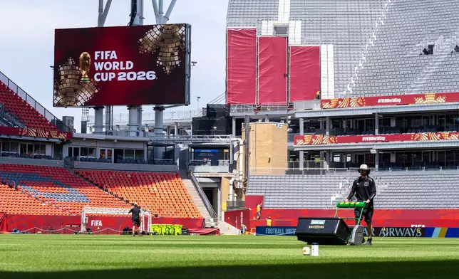 FILE - A worker mows the grass at Toronto Stadium on June 4, 2026, in Toronto, in preparation for the World Cup soccer tournament. (Frank Gunn/The Canadian Press via AP, File)