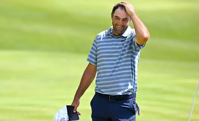 Scottie Scheffler reacts after finishing the second round of the Travelers Championship golf tournament at TPC River Highlands, Friday, June 26, 2026, in Cromwell, Conn. (AP Photo/Jessica Hill)