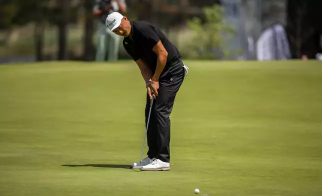 China's Haotong Li putts on the ninth hole during the second round of the RBC Canadian Open in Caledon, Ont., on Friday, June 12, 2026. (Nick Iwanyshyn/The Canadian Press via AP)